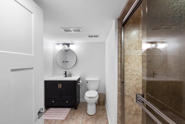 11616 N Lantern Ln, Mequon, WI 53092 - full bath with vanity, a tile shower, tile patterned floors, and toilet