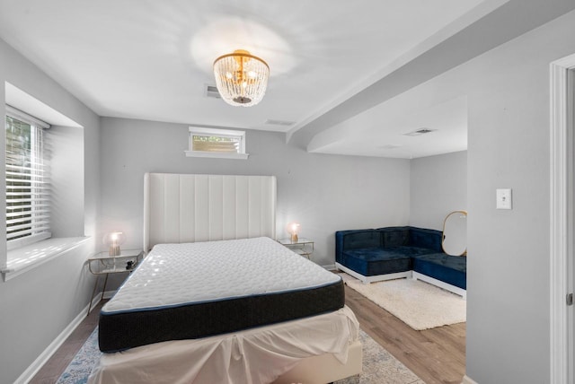 11616 N Lantern Ln, Mequon, WI 53092 - bedroom featuring wood finished floors and baseboards