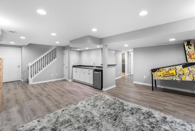 11616 N Lantern Ln, Mequon, WI 53092 - kitchen with wood finished floors, baseboards, white cabinets, a sink, and recessed lighting