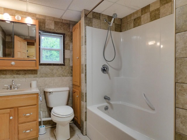 N11475 Post Lake Dr, Elcho, WI 54428 - full bathroom with tile walls, vanity, toilet, shower / bath combination, and tile patterned floors