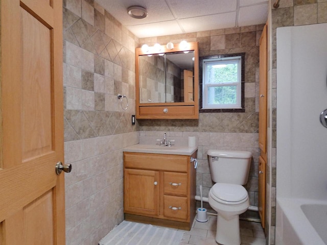 N11475 Post Lake Dr, Elcho, WI 54428 - full bathroom with toilet, vanity, tile walls, tile patterned flooring, and bathing tub / shower combination