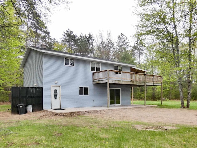 N11475 Post Lake Dr, Elcho, WI 54428 - rear view of property featuring dirt driveway, a deck, a chimney, and a patio