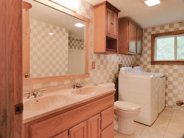 N11475 Post Lake Dr, Elcho, WI 54428 - full bathroom featuring independent washer and dryer, double vanity, toilet, a shower, and tile patterned flooring