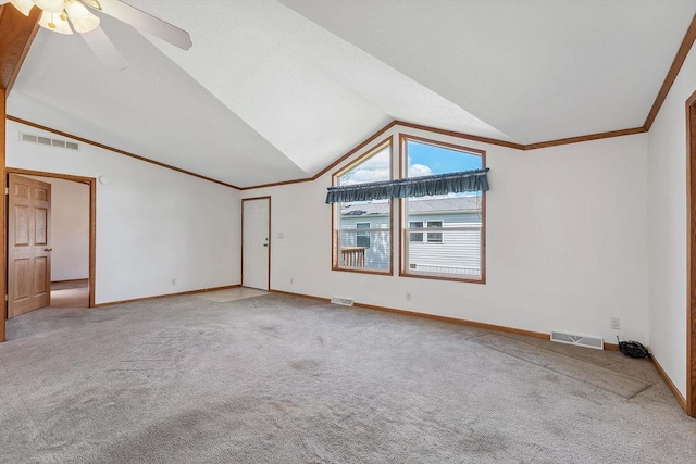 2701 E Main St Unit 136, Reedsburg, WI 53959 - carpeted spare room featuring lofted ceiling, baseboards, ceiling fan, and crown molding