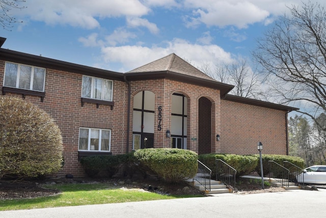 6575 N Green Bay Ave Unit 211, Glendale, WI 53209 - view of front of house featuring brick siding