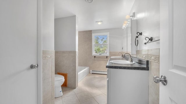 1007 Forest Hill Dr, Green Bay, WI 54311 - full bath featuring a baseboard radiator, tile walls, tile patterned floors, vanity, and toilet