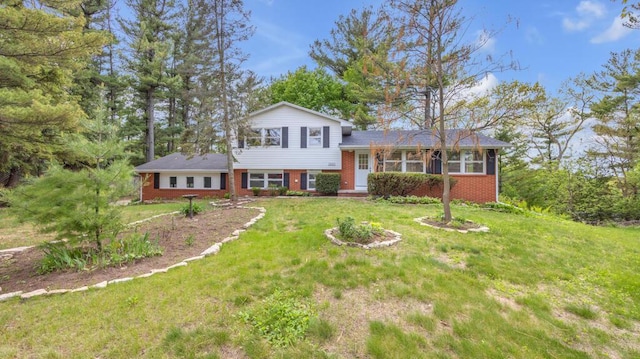 1007 Forest Hill Dr, Green Bay, WI 54311 - tri-level home with brick siding and a front yard