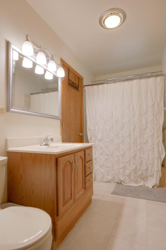 1349 93rd Ave, Kenosha, WI 53144 - full bath with toilet, vanity, tile patterned floors, and a shower with curtain