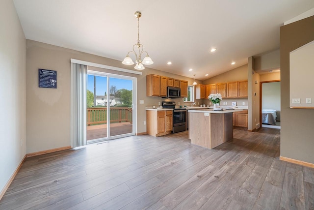 5406 Rock Rapids Dr, Weston, WI 54476 - kitchen with appliances with stainless steel finishes, light countertops, a chandelier, light wood-style floors, and baseboards