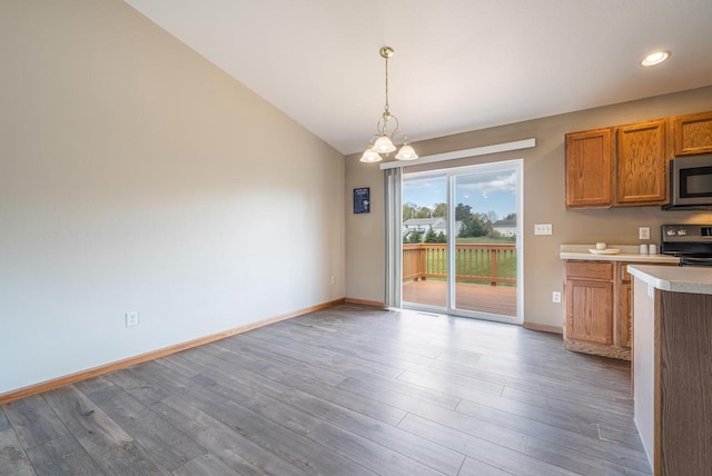 5406 Rock Rapids Dr, Weston, WI 54476 - kitchen with stainless steel appliances, light countertops, brown cabinets, and wood finished floors