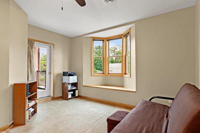 115 E Broadway Unit 210, Monona, WI 53716 - sitting room with baseboards, carpet floors, and a ceiling fan