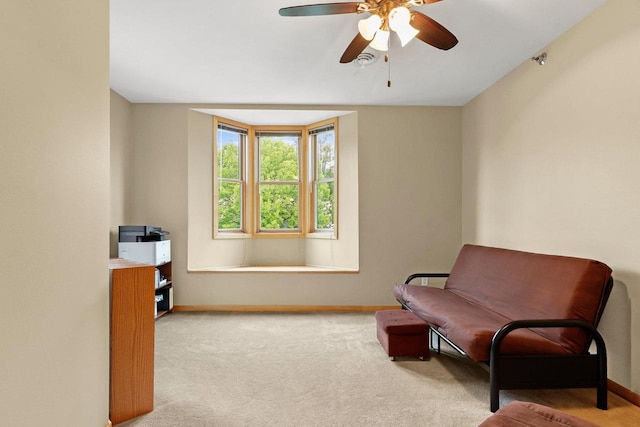115 E Broadway Unit 210, Monona, WI 53716 - living area with ceiling fan, baseboards, and carpet flooring