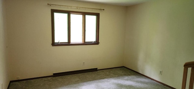 3315 N 12th St, Wausau, WI 54403 - carpeted spare room featuring a baseboard heating unit and baseboards
