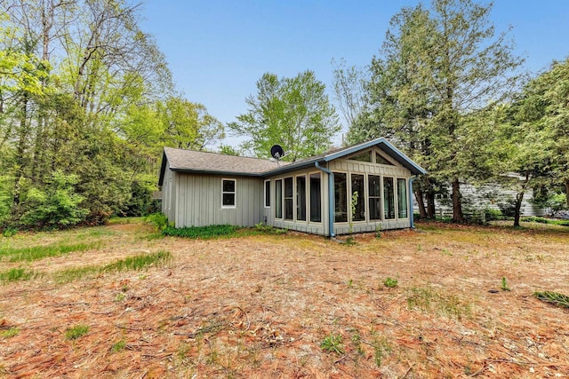 N7119 River Dr, Shawano, WI 54166 - rear view of property with a sunroom and board and batten siding