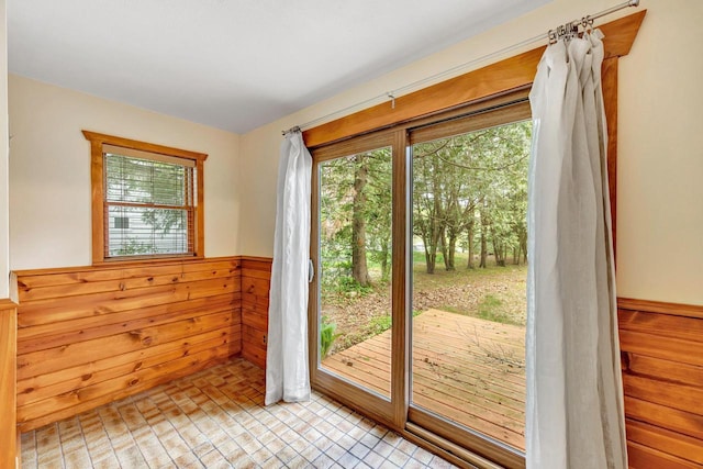 N7119 River Dr, Shawano, WI 54166 - doorway to outside featuring a wainscoted wall and wood walls
