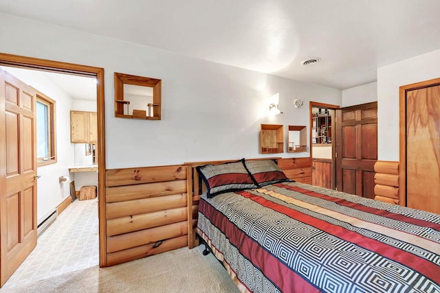 N7119 River Dr, Shawano, WI 54166 - bedroom with a baseboard heating unit, log walls, and carpet floors