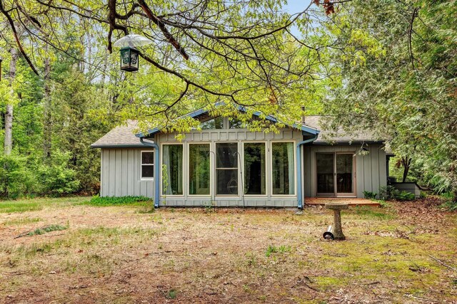 N7119 River Dr, Shawano, WI 54166 - back of property featuring board and batten siding and a sunroom