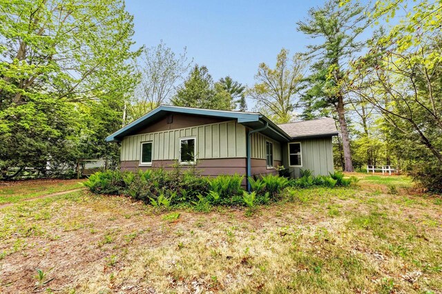 N7119 River Dr, Shawano, WI 54166 - view of side of property with board and batten siding