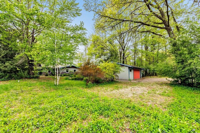 N7119 River Dr, Shawano, WI 54166 - view of yard featuring a garage