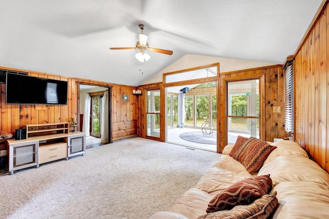 N7119 River Dr, Shawano, WI 54166 - carpeted living room featuring wooden walls, lofted ceiling, and a ceiling fan