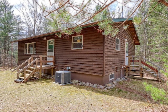 13848 Sabin Rd, Hayward, WI 54843 - view of property exterior with central air condition unit and stairs
