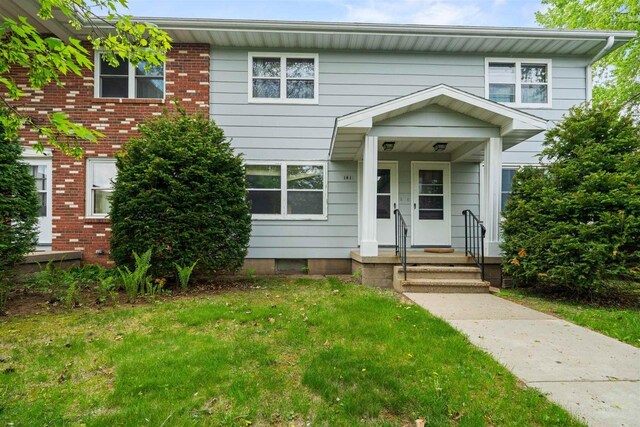 1416 21st Ave S, Wisconsin Rapids, WI 54495 - multi unit property featuring a front lawn and brick siding