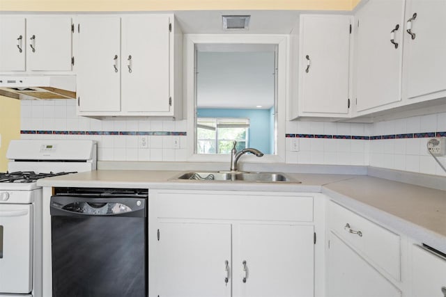 1416 21st Ave S, Wisconsin Rapids, WI 54495 - kitchen with black dishwasher, under cabinet range hood, white gas stove, a sink, and tasteful backsplash