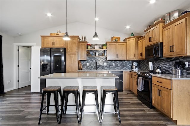 118 Dunn St, Colfax, WI 54730 - kitchen featuring black appliances, open shelves, lofted ceiling, a kitchen breakfast bar, and light countertops