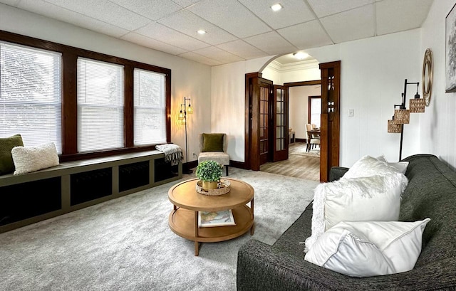 4416 75th St, Kenosha, WI 53142 - living area with arched walkways, healthy amount of natural light, a paneled ceiling, and stairs