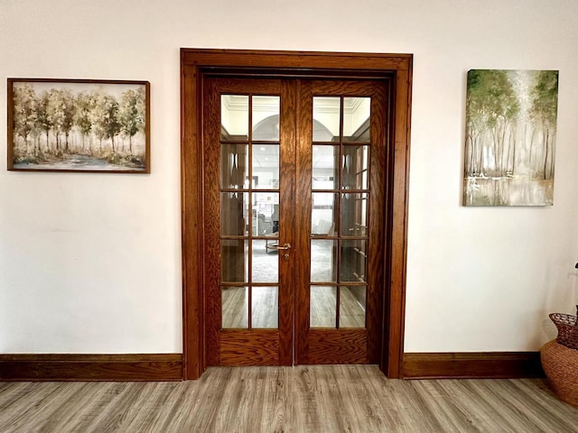 4416 75th St, Kenosha, WI 53142 - doorway with wood finished floors, french doors, and baseboards