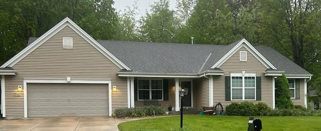 N100W14330 Sunburst Trl, Germantown, WI 53022 - view of front of house with driveway, a garage, a front lawn, and roof with shingles
