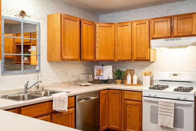 N100W14330 Sunburst Trl, Germantown, WI 53022 - kitchen featuring white gas range, dishwasher, under cabinet range hood, a sink, and light countertops