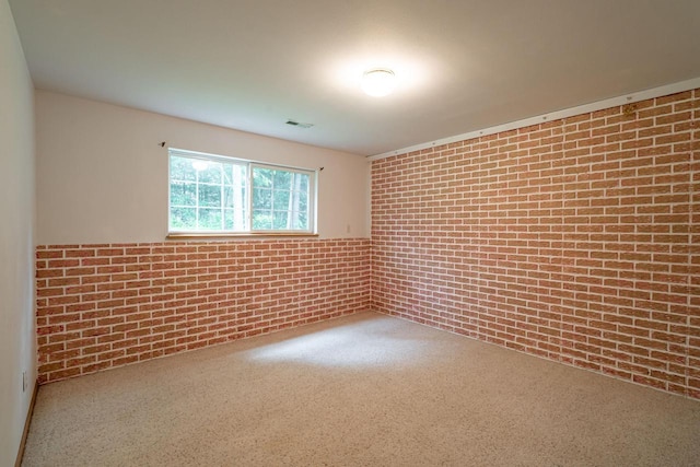 N100W14330 Sunburst Trl, Germantown, WI 53022 - carpeted spare room with brick wall