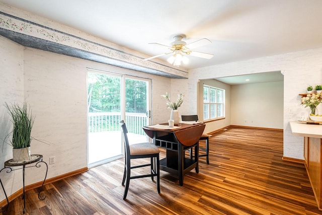 N100W14330 Sunburst Trl, Germantown, WI 53022 - dining room featuring wood finished floors, a ceiling fan, and baseboards