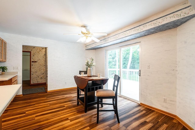 N100W14330 Sunburst Trl, Germantown, WI 53022 - dining space with dark wood-style flooring, baseboards, and a ceiling fan