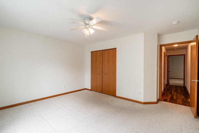 N100W14330 Sunburst Trl, Germantown, WI 53022 - unfurnished bedroom featuring carpet, baseboards, a closet, and ceiling fan