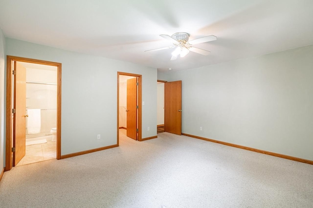 N100W14330 Sunburst Trl, Germantown, WI 53022 - unfurnished bedroom with baseboards, light colored carpet, a spacious closet, and ensuite bathroom