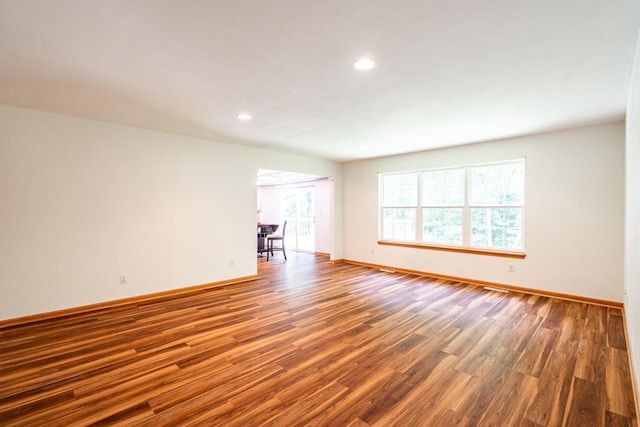 N100W14330 Sunburst Trl, Germantown, WI 53022 - unfurnished room with wood finished floors, baseboards, and recessed lighting