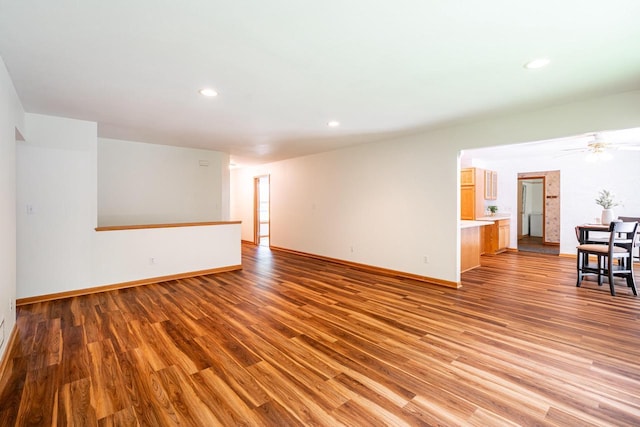 N100W14330 Sunburst Trl, Germantown, WI 53022 - empty room with wood finished floors, baseboards, and recessed lighting