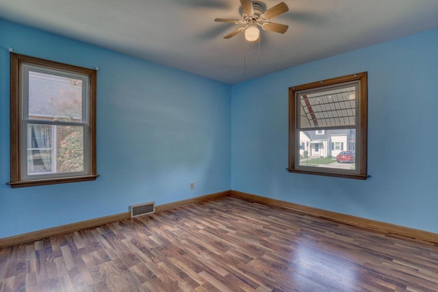 167 Po St, West Bend, WI 53090 - unfurnished room featuring wood finished floors, ceiling fan, and baseboards