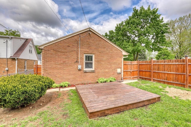 167 Po St, West Bend, WI 53090 - fenced backyard featuring a wooden deck