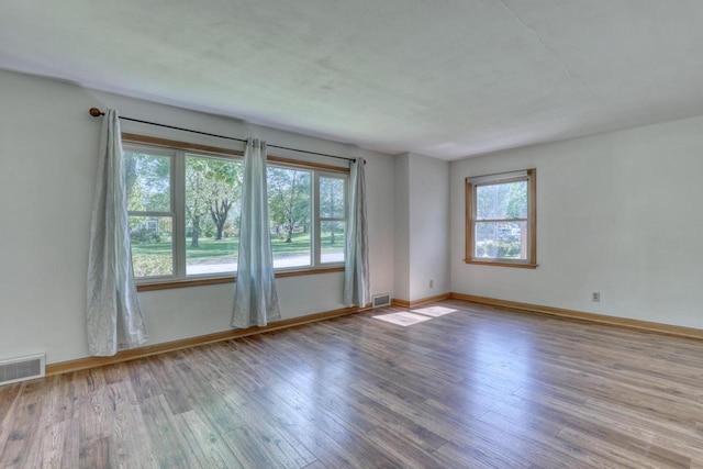 167 Po St, West Bend, WI 53090 - unfurnished room featuring wood finished floors and baseboards