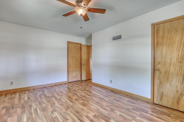 167 Po St, West Bend, WI 53090 - spare room featuring light wood finished floors, a ceiling fan, and baseboards