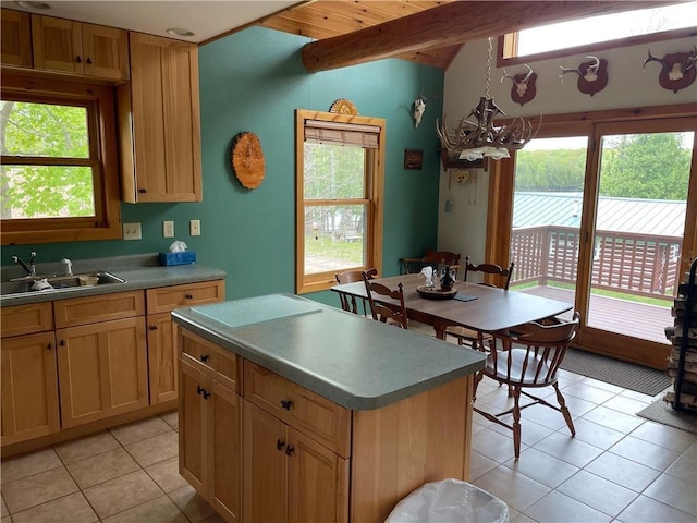 23165 Joy Villa Rd Unit 6, Glidden, WI 54527 - kitchen featuring light tile patterned flooring, vaulted ceiling, a chandelier, a sink, and a kitchen island