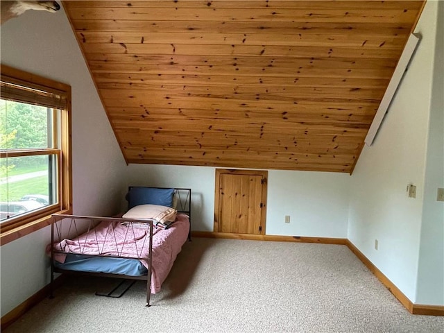 23165 Joy Villa Rd Unit 6, Glidden, WI 54527 - bedroom featuring wooden ceiling, carpet flooring, lofted ceiling, and baseboards