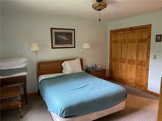 23165 Joy Villa Rd Unit 6, Glidden, WI 54527 - bedroom featuring a closet, light colored carpet, and baseboards