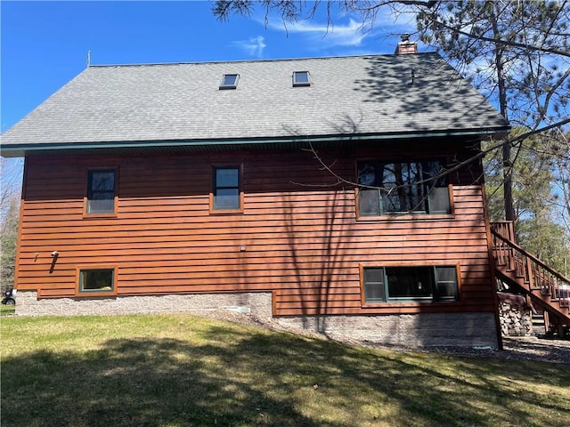 23165 Joy Villa Rd Unit 6, Glidden, WI 54527 - view of home's exterior with stairway, roof with shingles, and a yard