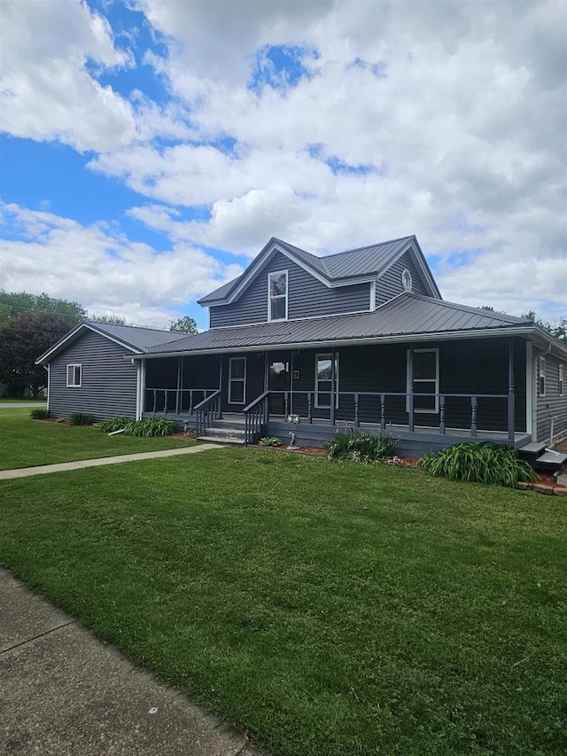 301 Superior St, Boscobel, WI 53805 - farmhouse inspired home featuring a front yard, metal roof, and a porch