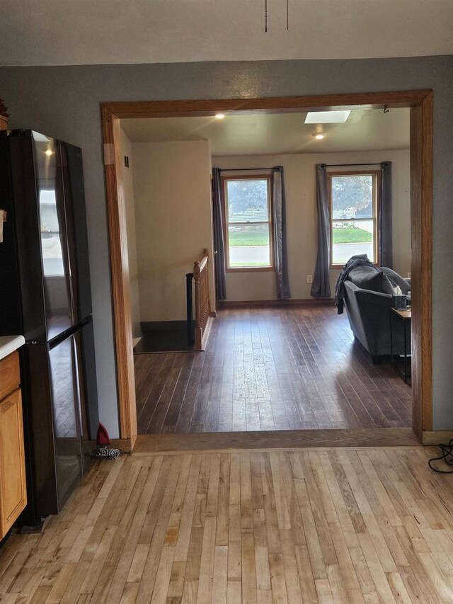 301 Superior St, Boscobel, WI 53805 - kitchen with freestanding refrigerator, light wood-style floors, and baseboards