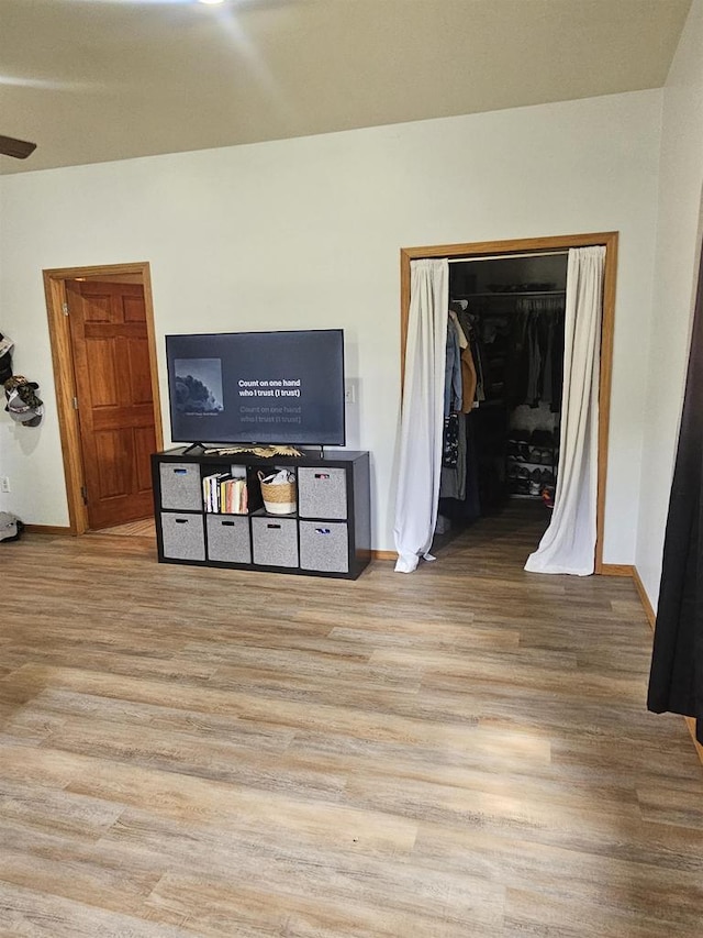 301 Superior St, Boscobel, WI 53805 - living room with wood finished floors, baseboards, and ceiling fan